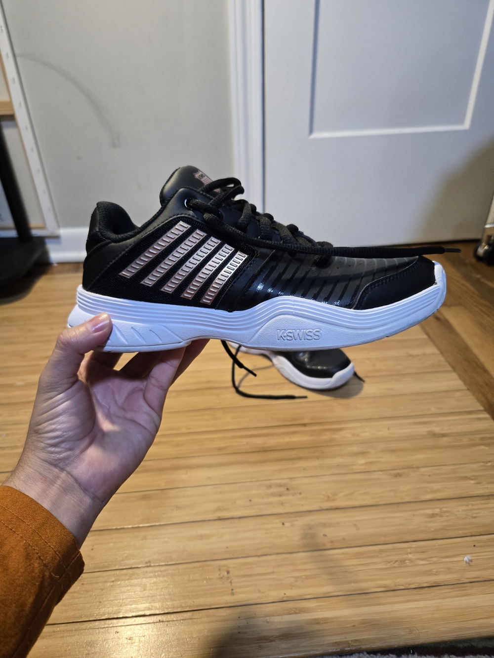 K-Swiss  Women  Black and Rose Gold Athletic Sneaker